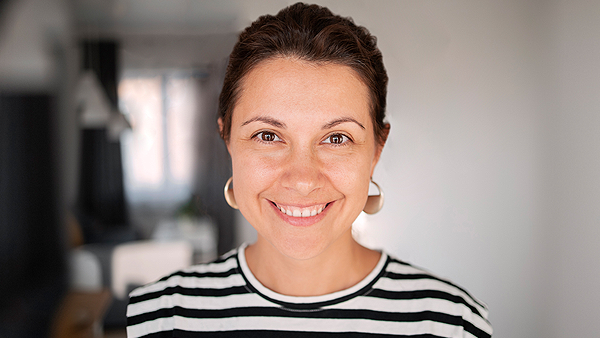 Young woman smiling at camera.